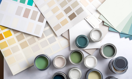Various paint swatches and open paint cans.