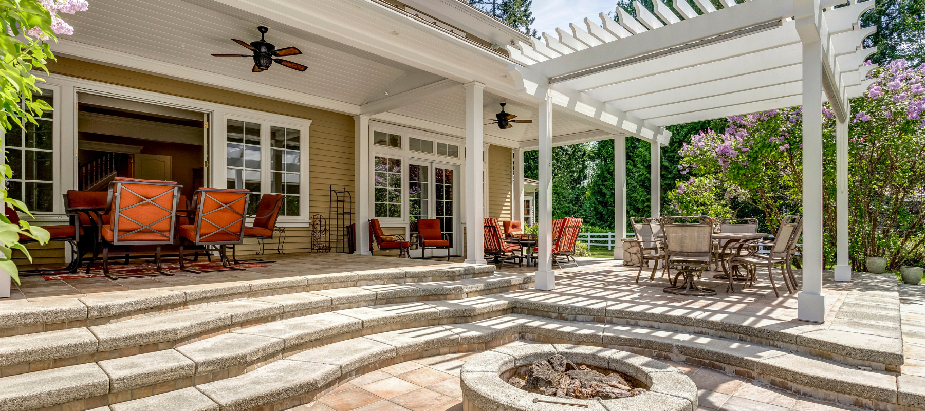 An outdoor pergola and patio setup on a clear day.