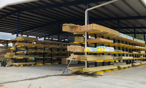 Stacked lumber at a lumberyard.